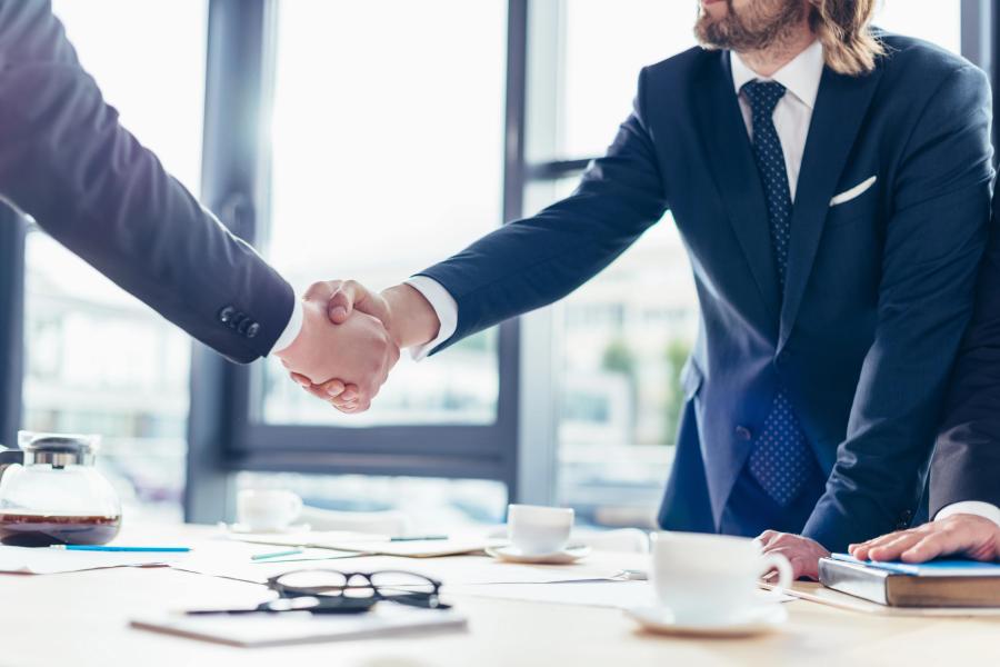 two men handshaking closing the deal